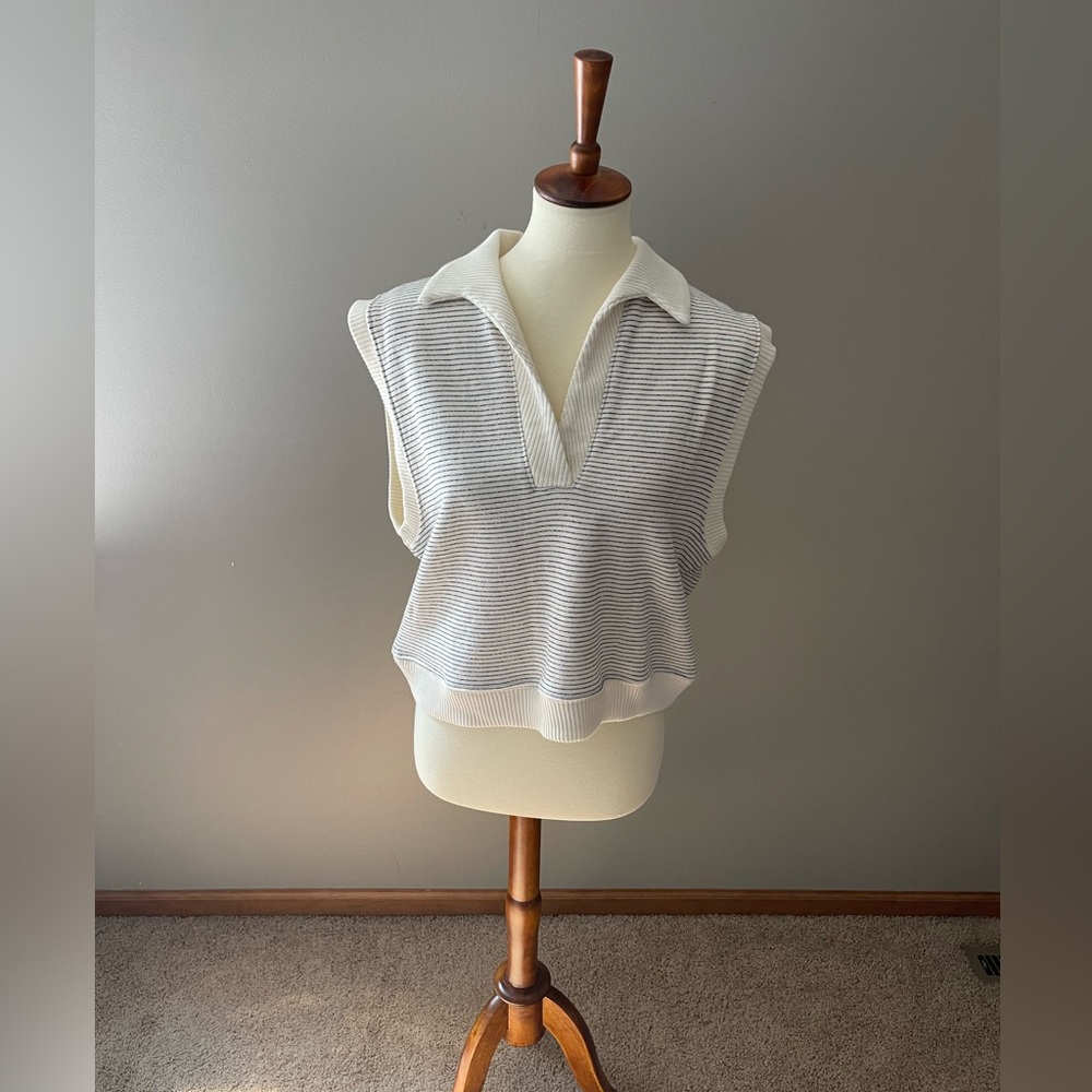 From an online boutique. Cute cream with black stripe.